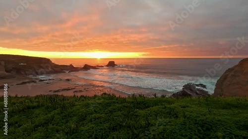 Sunset at the Zambujeira do Mar beach, Alentejo, Portugal. Portugal Hiking Rota Vicentina the Fisherman's Trail Along the Alentejo Coastline to Wild and Rugged Beaches Narrow Cliff Side Paths. photo