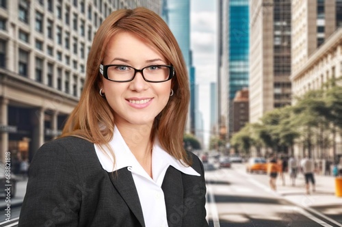 Photography Young business woman standing in city street