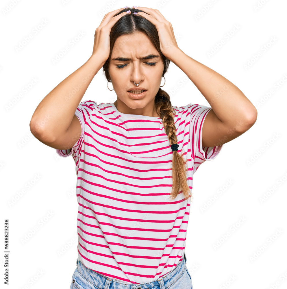 Young hispanic woman wearing casual clothes suffering from headache desperate and stressed because pain and migraine. hands on head. Young hispanic woman wearing casual clothes suffering from headache desperate and stressed because pain and migraine. hands on head.