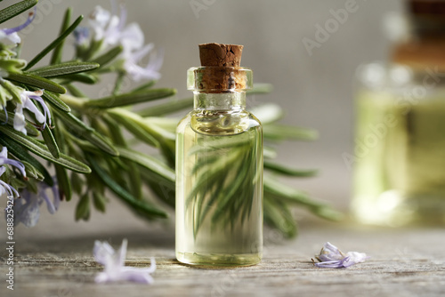 Rosemary essential oil in a glass bottle