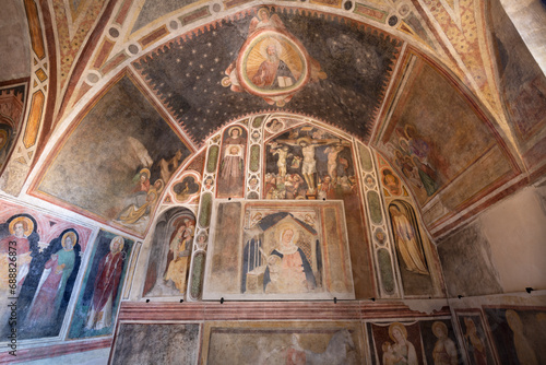 TREVISO, ITALY - NOVEMBER 8, 2023: The frescoes in the church Chiesa di San VIto e Santa Lucia by Tomaso da Modena from first half of 14. cent.  photo