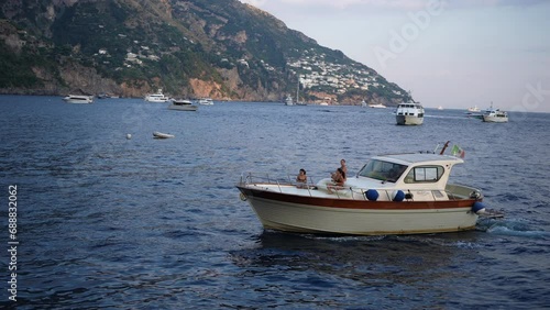 Wallpaper Mural Amalfi, Italy - 3 September 2023. View from tourist ferry of boat cruising along Positano coast. Looking at hillside town houses on Amalfi coast from ferry boat. Concept of vacations and travel. Torontodigital.ca