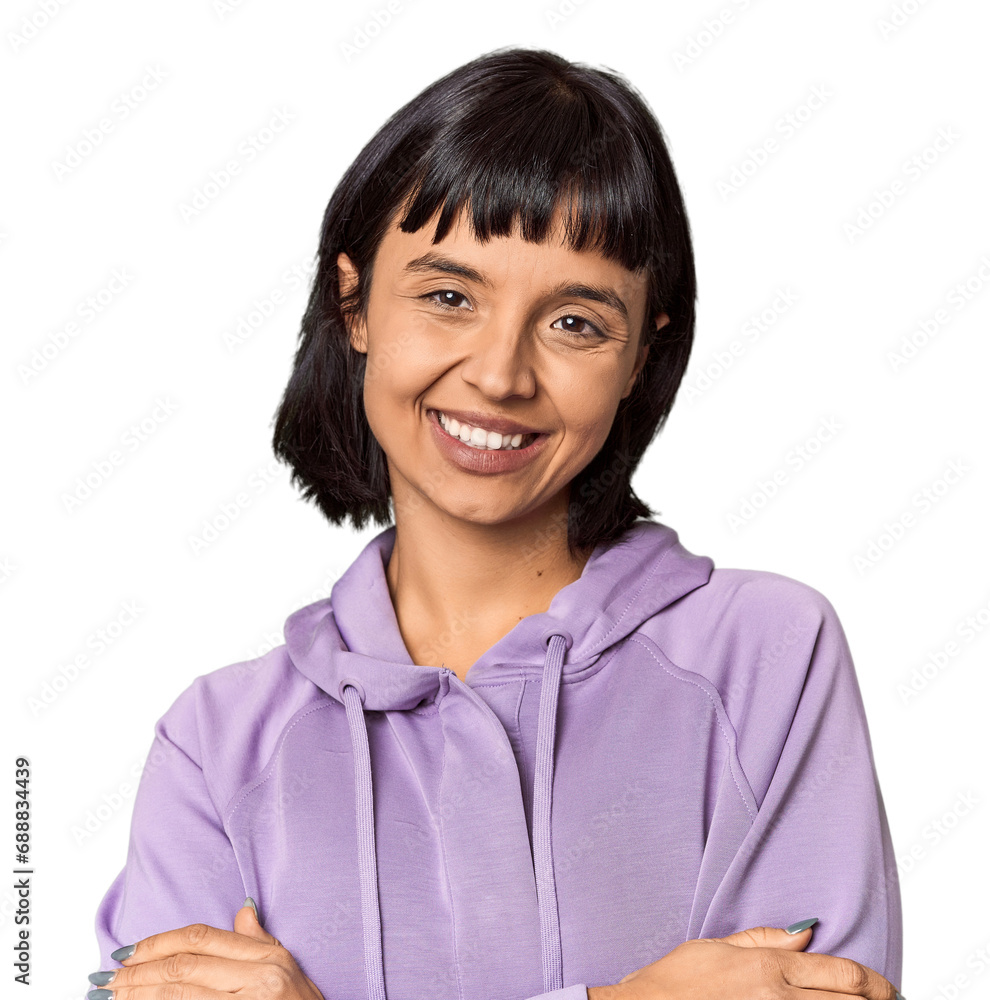 Young Hispanic woman with short black hair in studio who feels confident, crossing arms with determination. Young Hispanic woman with short black hair in studio who feels confident, crossing arms with determination.