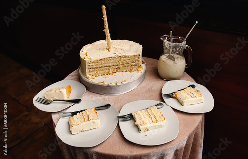 Sliced wedding cake with pieces laid out on plates, the end of the wedding ceremony