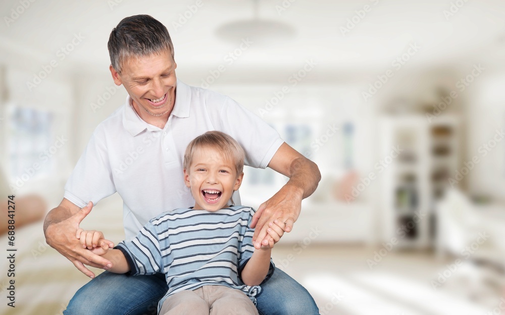 Playful father have fun with son in park Playful father have fun with son in park