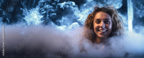 Embracing the warmth, a satisfied woman revels in a thermal bath, her smile radiating amidst rising steam, a visual testament to relaxation and well-being