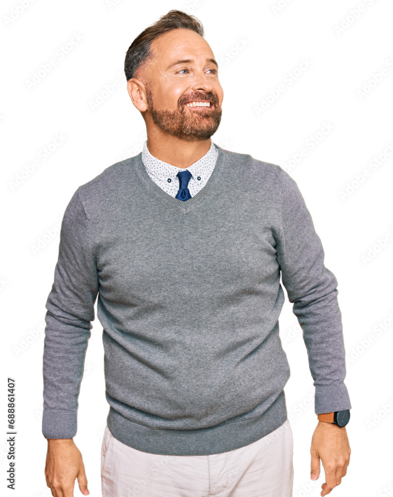 Handsome middle age man wearing business clothes looking away to side with smile on face, natural expression. laughing confident. Handsome middle age man wearing business clothes looking away to side with smile on face, natural expression. laughing confident.
