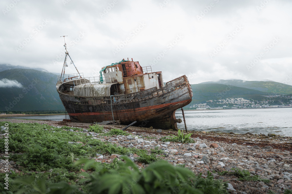 Old boat of Caol shipwreck in Corpach near Fort William on a rainy day.Tourism,scottish landmarks