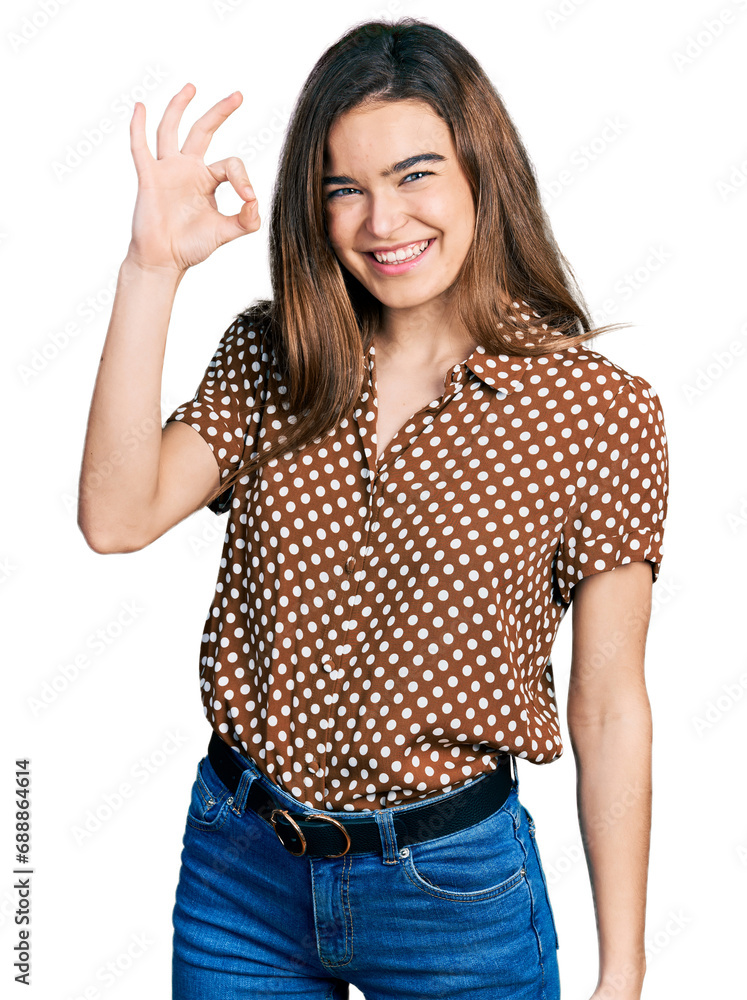 Young caucasian girl wearing casual clothes smiling positive doing ok sign with hand and fingers. successful expression. Young caucasian girl wearing casual clothes smiling positive doing ok sign with hand and fingers. successful expression.
