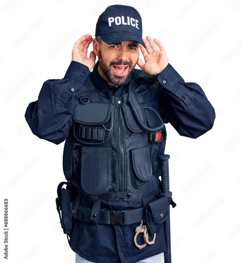 Young hispanic man wearing police uniform trying to hear both hands on ear gesture, curious for gossip. hearing problem, deaf Young hispanic man wearing police uniform trying to hear both hands on ear gesture, curious for gossip. hearing problem, deaf