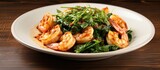Pan-seared shrimp with garlic and greens.