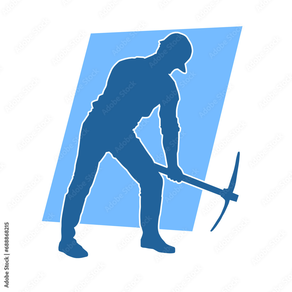 Fototapeta premium Silhouette of a man in worker costume carrying pick axe tool in action pose.