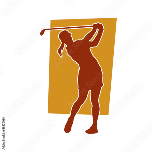 Silhouette of a woman playing golf. Silhouette of a female golfer in action pose.