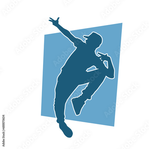 Silhouette of a male dancer in performing pose. Silhouette of a dancing man.