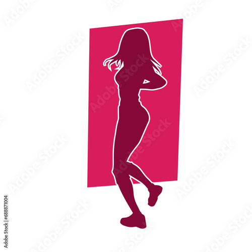 Silhouette of a slim female dance pose. Silhouette of a female in aerobic movement.