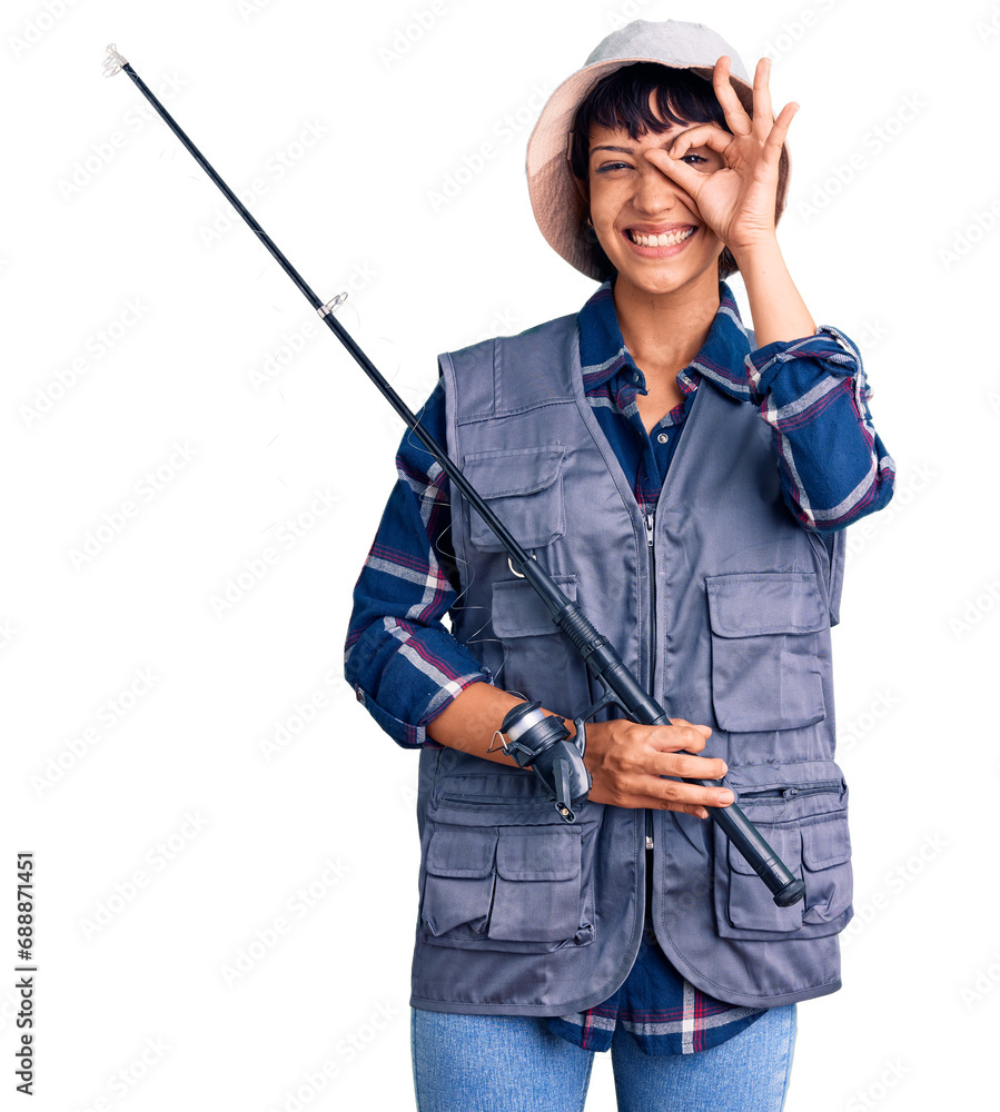 Young brunette woman with short hair wearing fisherman equipment smiling happy doing ok sign with hand on eye looking through fingers Young brunette woman with short hair wearing fisherman equipment smiling happy doing ok sign with hand on eye looking through fingers