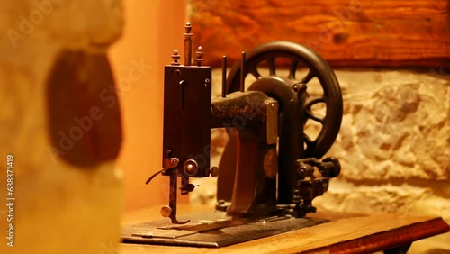 Vintage foot operated mechanical sewing machine from the late 19th century. Antique Seidel and Naumann Hand crank Transverse Shuttle Sewing machine. Istria, Croatia - November 25, 2023 photo