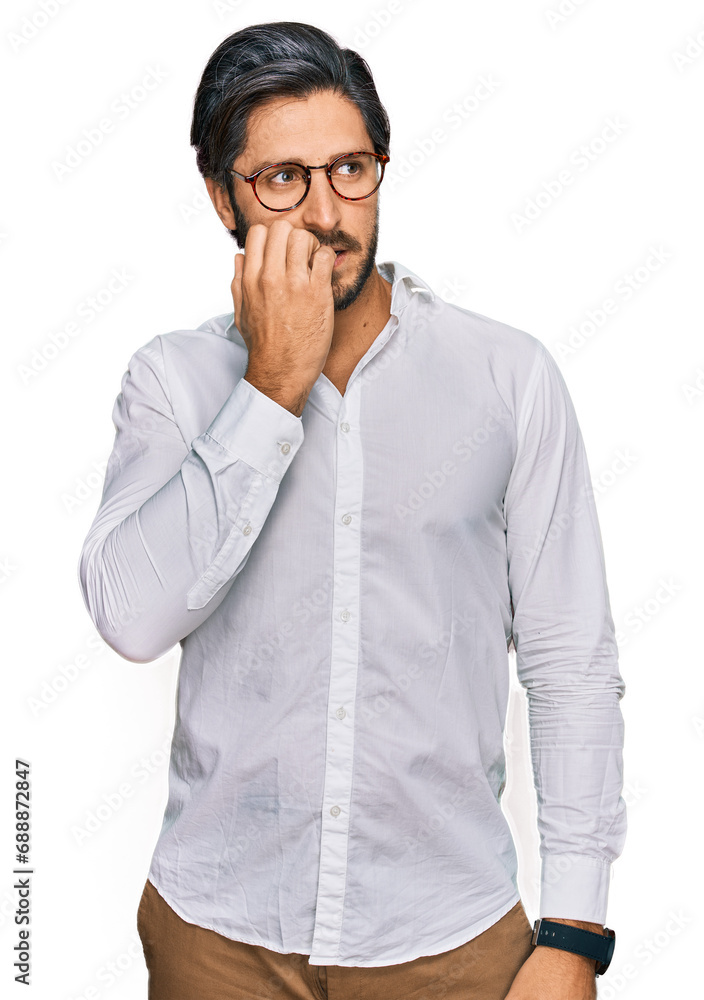 Young hispanic man wearing business shirt and glasses looking stressed and nervous with hands on mouth biting nails. anxiety problem. Young hispanic man wearing business shirt and glasses looking stressed and nervous with hands on mouth biting nails. anxiety problem.