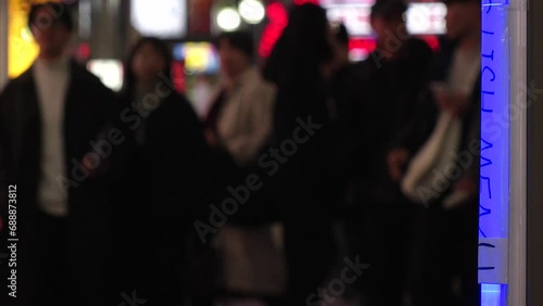 SHINJUKU, TOKYO, JAPAN - NOV 2023 : KABUKICHO downtown area at night. Colorful led neon street signs at entertainment district. Japanese urban nightlife and drinking concept video. Time lapse shot. photo