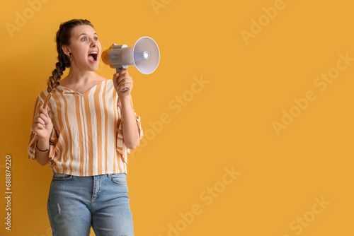 Young woman shouting into m...