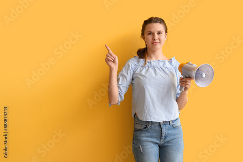 Young woman with megaphone ...