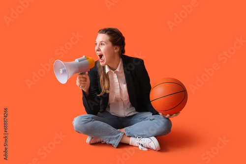 Young woman with ball shout...