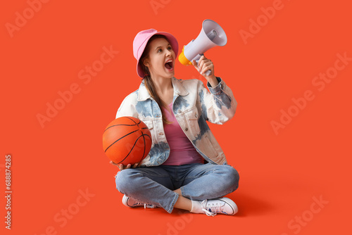 Young woman with ball shout...