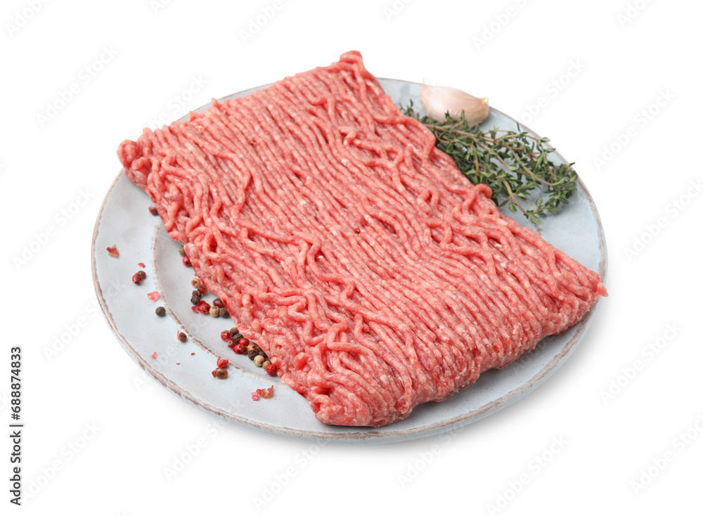 Fresh raw ground meat, peppercorns, garlic and thyme isolated on white Fresh raw ground meat, peppercorns, garlic and thyme isolated on white