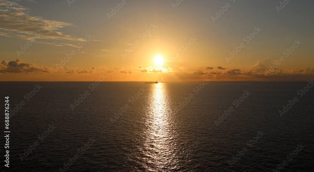 Cargo ship sailing tranquil ocean