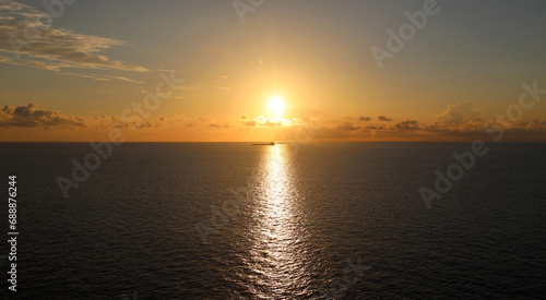 Cargo ship sailing tranquil ocean