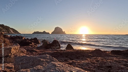 Timelapse of the sunset at Es Vedra Island Ibiza photo