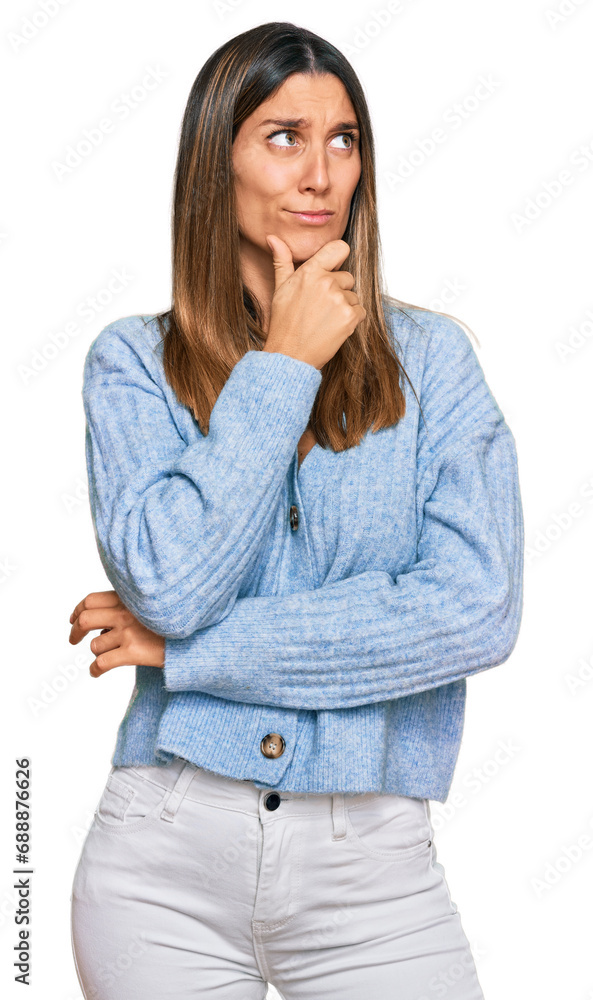 Young woman wearing casual clothes thinking worried about a question, concerned and nervous with hand on chin Young woman wearing casual clothes thinking worried about a question, concerned and nervous with hand on chin