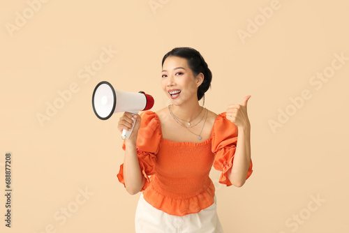 Young Asian woman with mega...