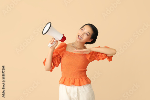 Young Asian woman with mega...