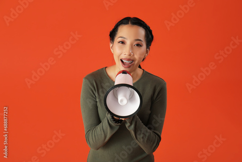 Young Asian woman with mega...