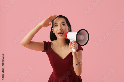 Young Asian woman with mega...