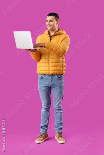 Young man in warm puffer ja...