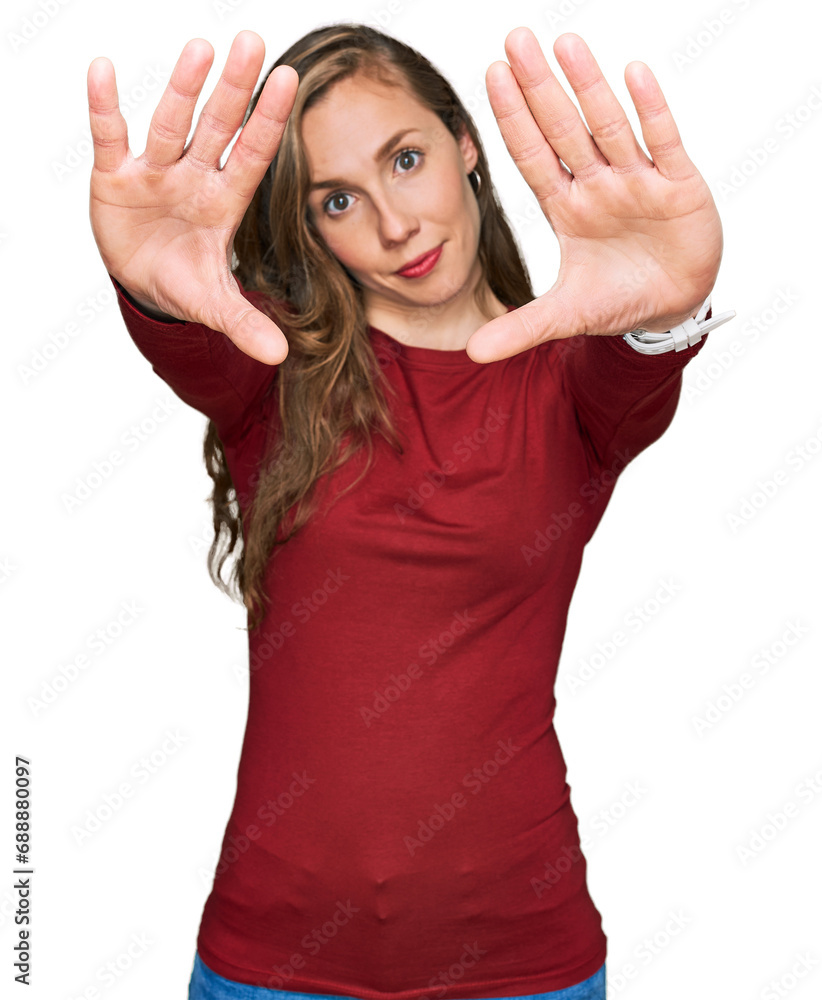 Young blonde woman wearing casual clothes doing frame using hands palms and fingers, camera perspective Young blonde woman wearing casual clothes doing frame using hands palms and fingers, camera perspective