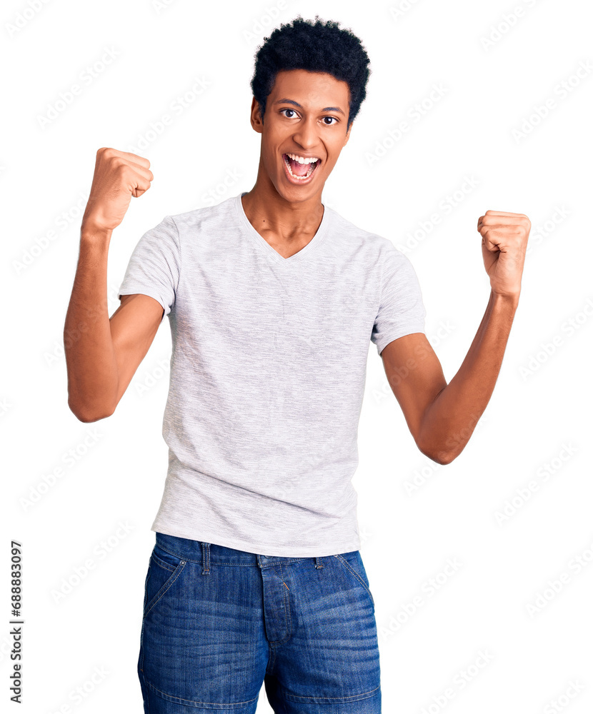 Young african american man wearing casual white t shirt screaming proud, celebrating victory and success very excited with raised arms Young african american man wearing casual white t shirt screaming proud, celebrating victory and success very excited with raised arms