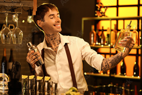 Young bartender with tequil...