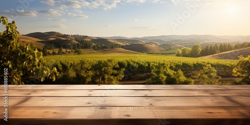 Wooden table overlooking a lush vineyard at sunset, suitable for winery and travel marketing.