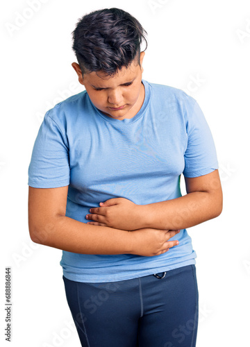 Little boy kid wearing sports workout clothes with hand on stomach because indigestion, painful illness feeling unwell. ache concept.