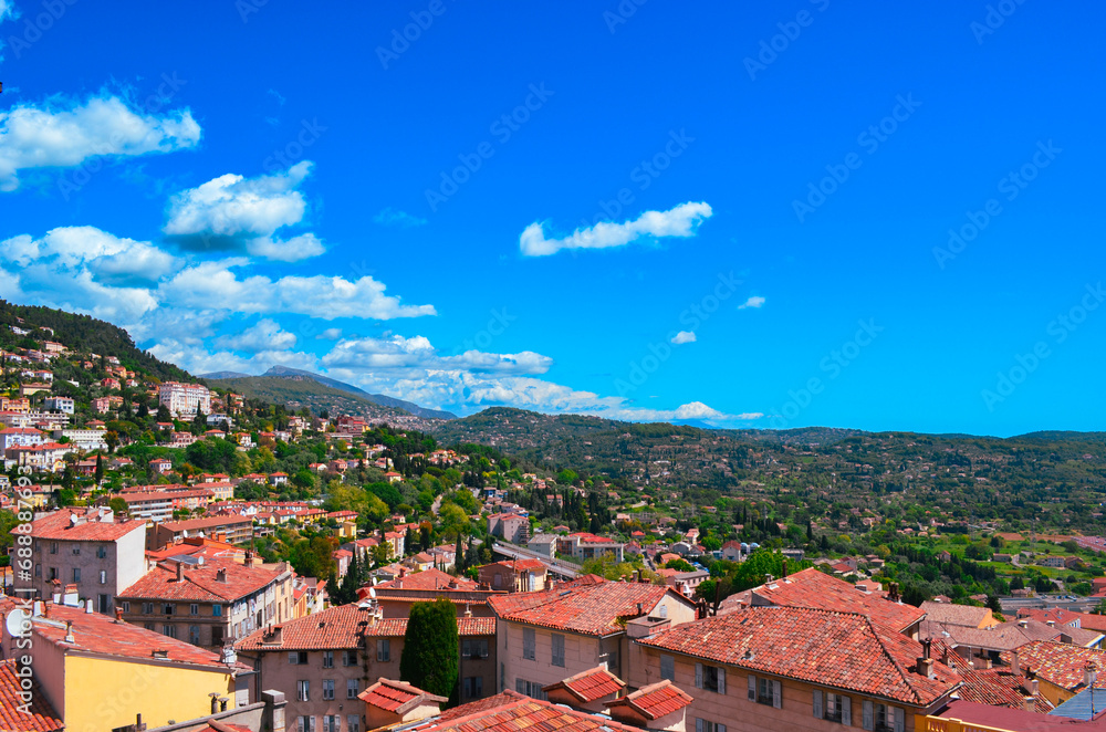 Mediterranean landscape with a mix of architecture and natural landscape with partly cloudy blue sky  