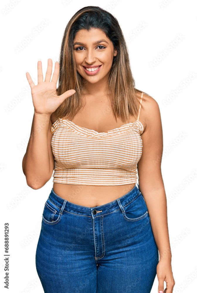 Beautiful brunette woman wearing casual clothes showing and pointing up with fingers number five while smiling confident and happy. Beautiful brunette woman wearing casual clothes showing and pointing up with fingers number five while smiling confident and happy.