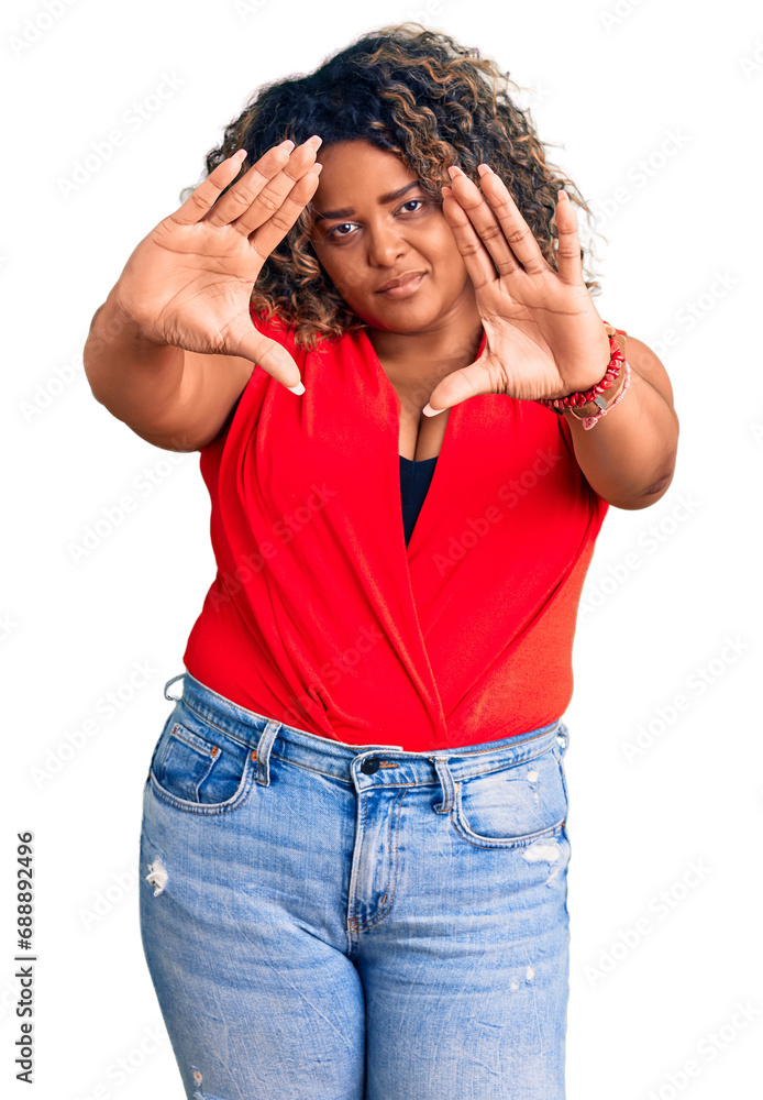 Young african american plus size woman wearing casual style with sleeveless shirt doing frame using hands palms and fingers, camera perspective Young african american plus size woman wearing casual style with sleeveless shirt doing frame using hands palms and fingers, camera perspective