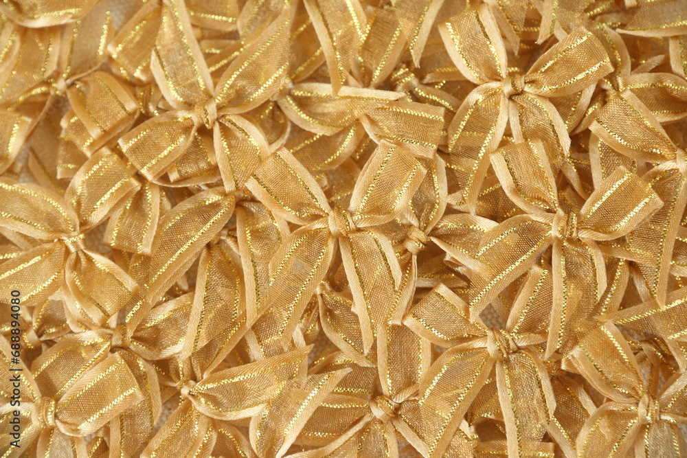 gold bows or ribbons background to congrate, celebrate, pride, or festival use gold bows or ribbons background to congrate, celebrate, pride, or festival use
