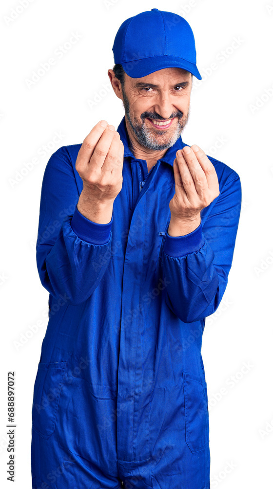 Middle age handsome man wearing mechanic uniform doing money gesture with hands, asking for salary payment, millionaire business