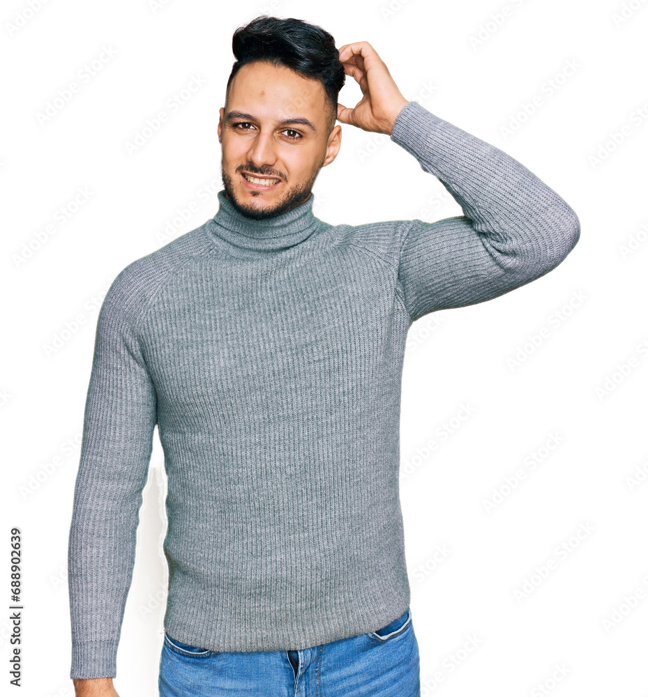 Young arab man wearing casual clothes confuse and wonder about question. uncertain with doubt, thinking with hand on head. pensive concept. Young arab man wearing casual clothes confuse and wonder about question. uncertain with doubt, thinking with hand on head. pensive concept.