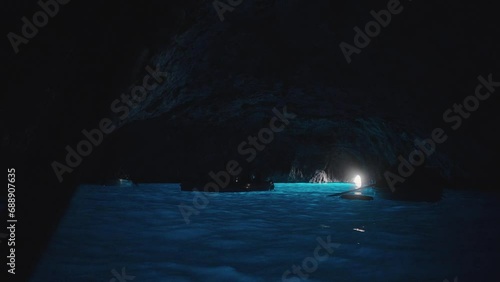 Tourist inside the Blue Cave (Grotta Azzurra) in the island of Capri photo