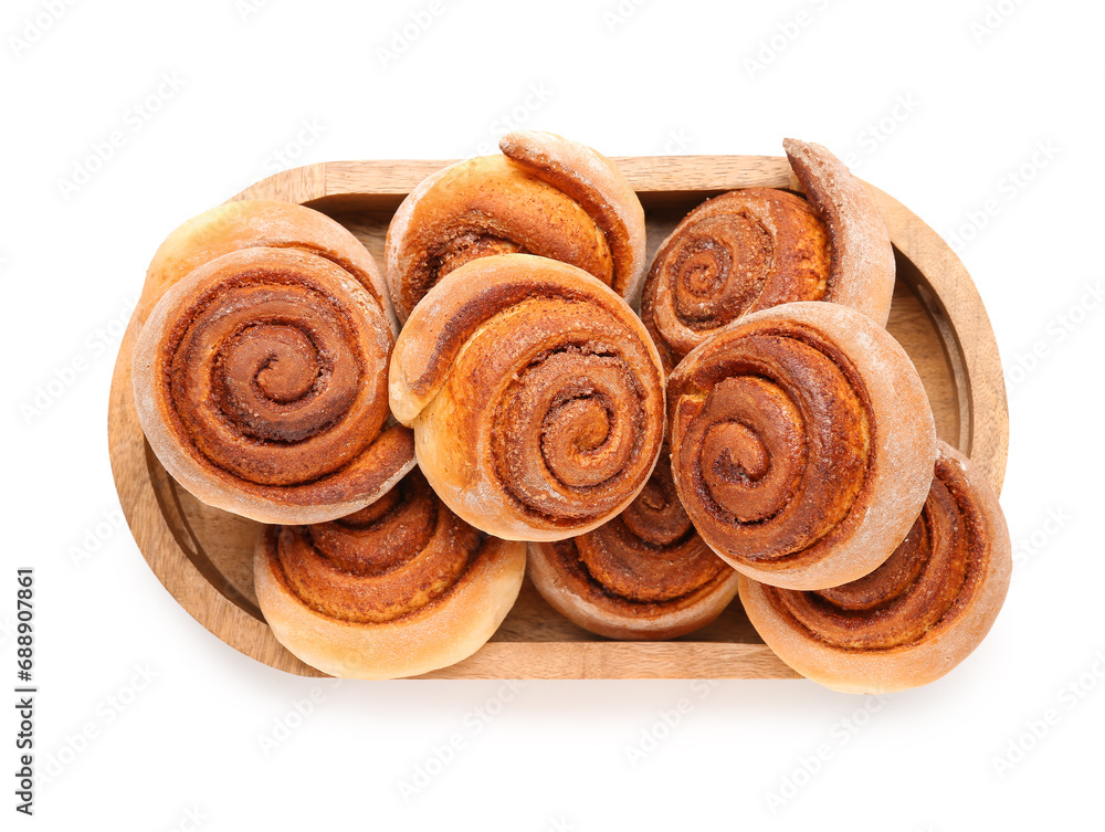 Fototapeta premium Wooden tray with tasty cinnamon rolls on white background